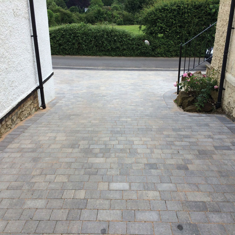Block paved driveway project in a clean residential setting.